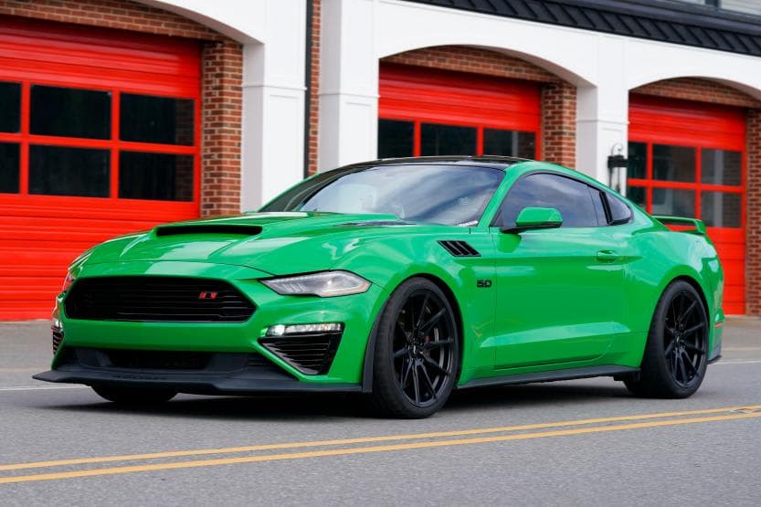 Continental ExtremeContact Sport 02 tires on a green Ford Mustang